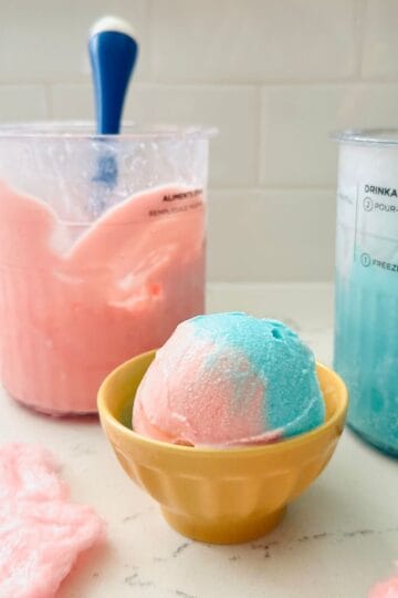 Scoops of cotton candy swirl ice cream ready to be enjoyed.