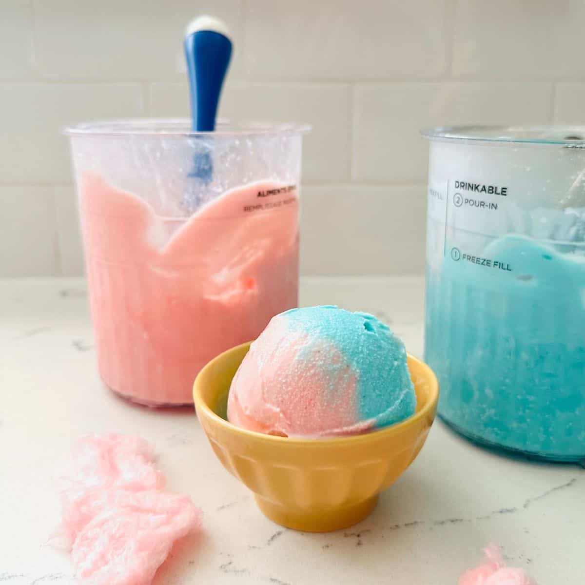 Scoops of cotton candy swirl ice cream ready to be enjoyed.