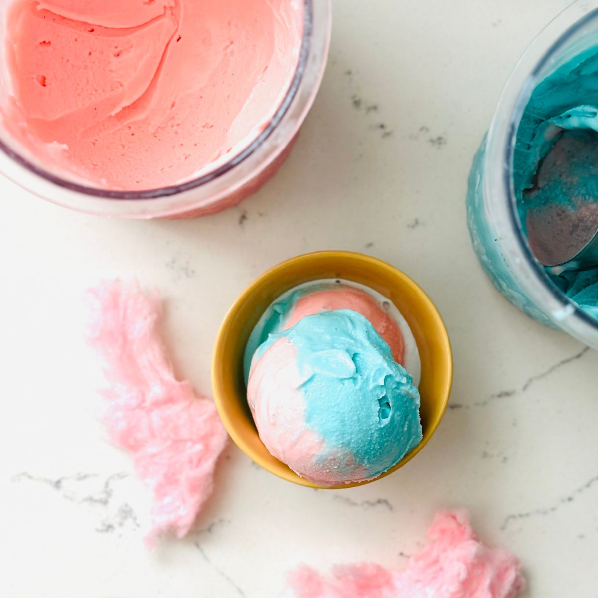 Scoops of cotton candy swirl ice cream ready to be enjoyed.