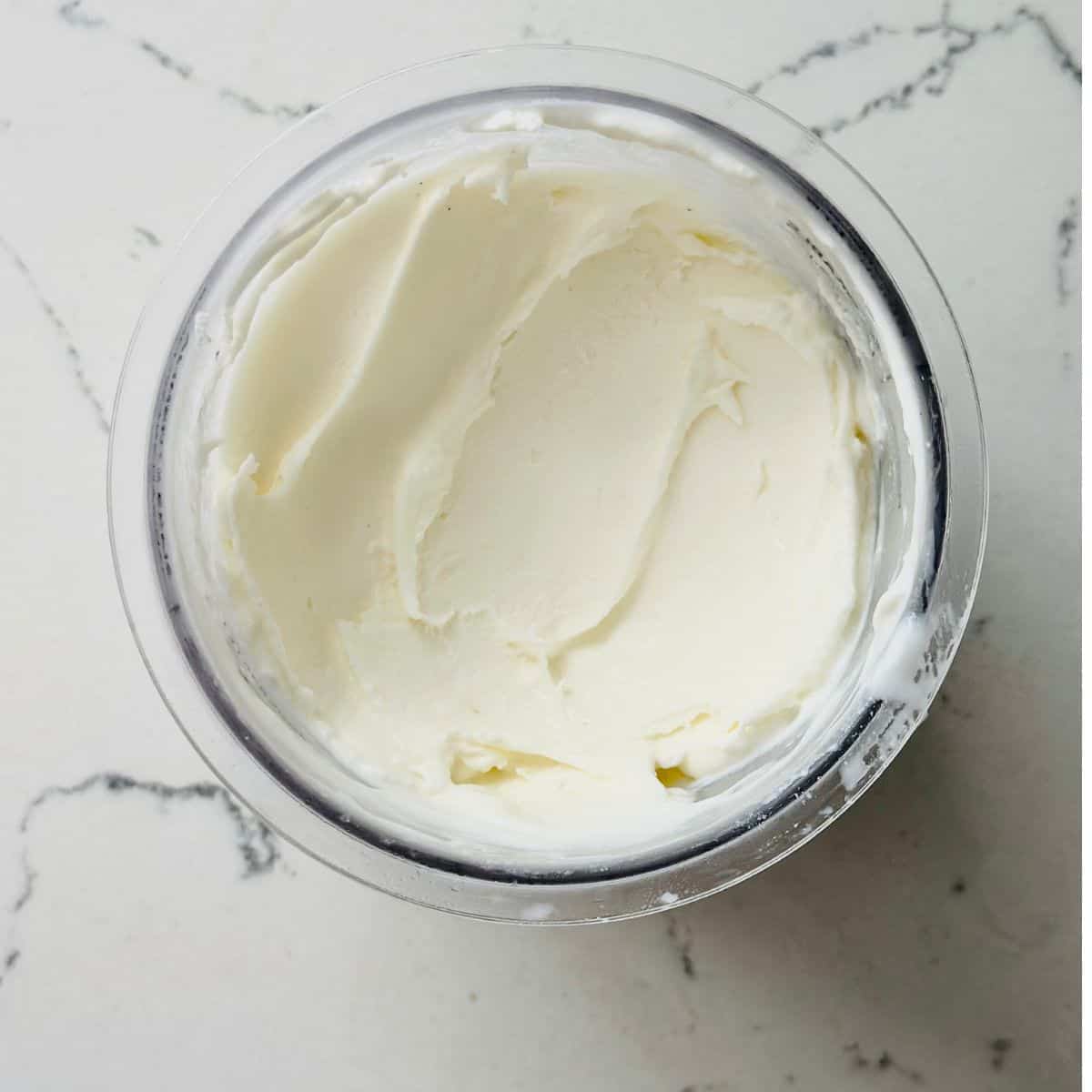 Creamy dairy-free vanilla ice cream ready for scooping.