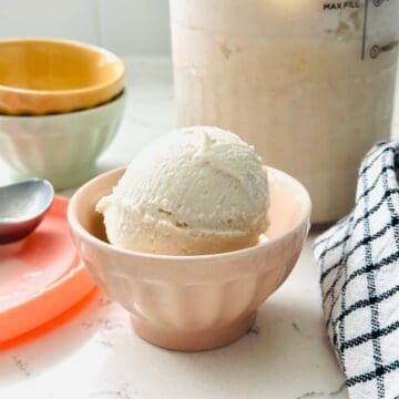 Scoops of high-protein vanilla ice cream in a bowl ready to be enjoyed.