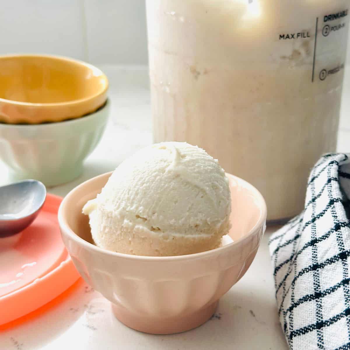 Scoops of high-protein vanilla ice cream in a bowl ready to be enjoyed.