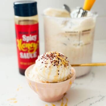 Scoops of hot honey ice cream with chili sprinkles and hot honey drizzles.