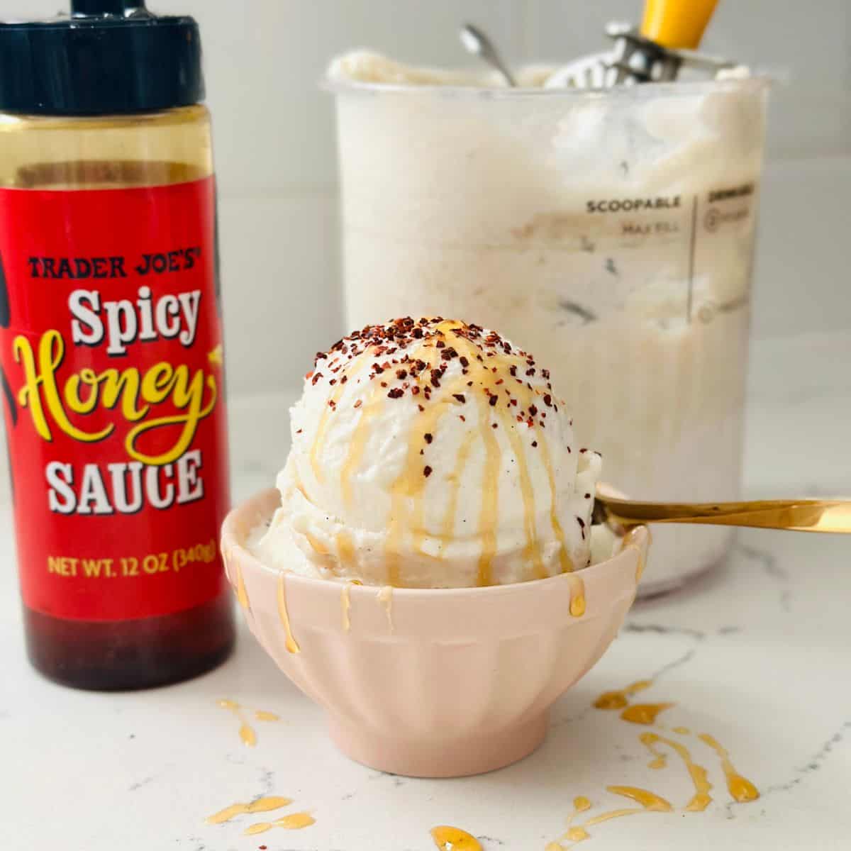 Scoops of hot honey ice cream with chili sprinkles and hot honey drizzles.