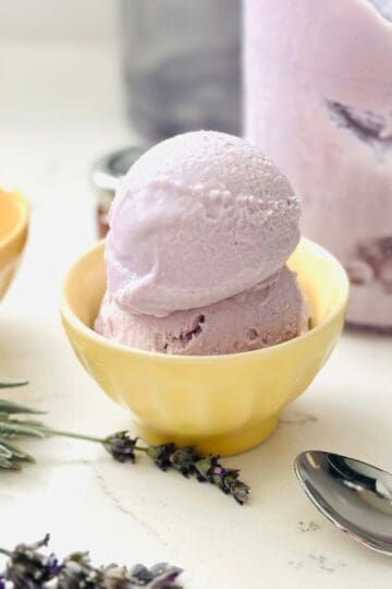 Scoops of lavender honey ice cream made with ninja creami in a bowl ready to be enjoyed.