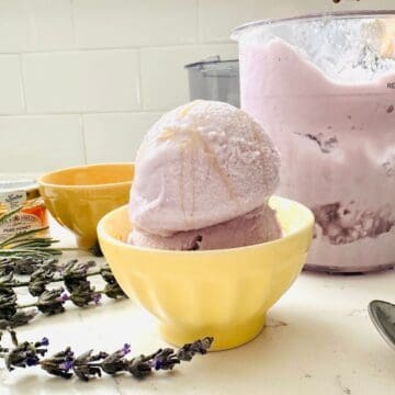 Scoops of lavender honey ice cream made with ninja creami in a bowl ready to be enjoyed.