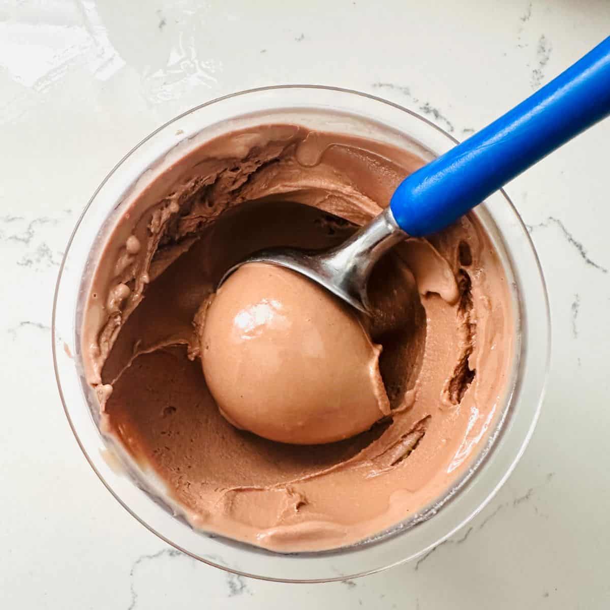 Scoop of Old-Fashioned Chocolate Ice Cream made with Ninja Creami showing creamy and velvety texture ready to be enjoyed.