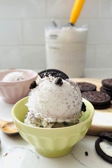 Scoops of Oreo Ice Cream in a bowl ready to be enjoyed.