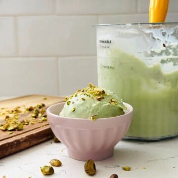 Scoops of pistachio ice cream in a bowl ready to be enjoyed.