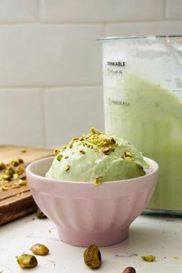 Scoops of pistachio ice cream in a bowl ready to be enjoyed.