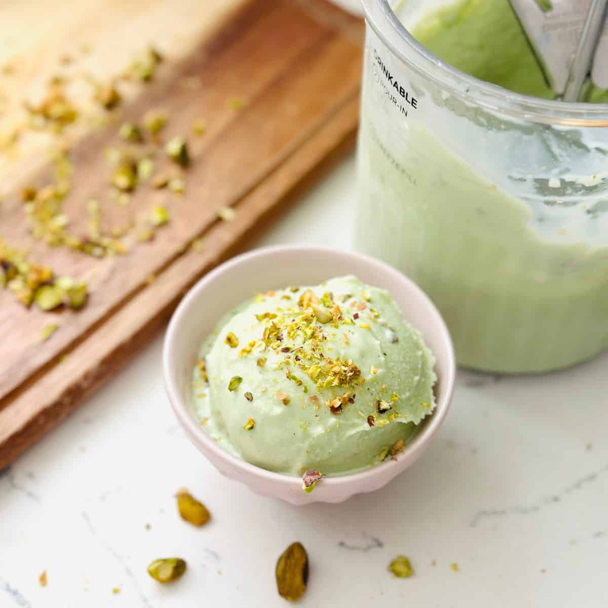 Scoops of pistachio ice cream in a bowl ready to be enjoyed.