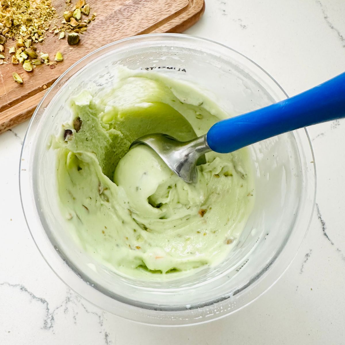 Scoop of pistachio ice cream ready to be enjoyed.