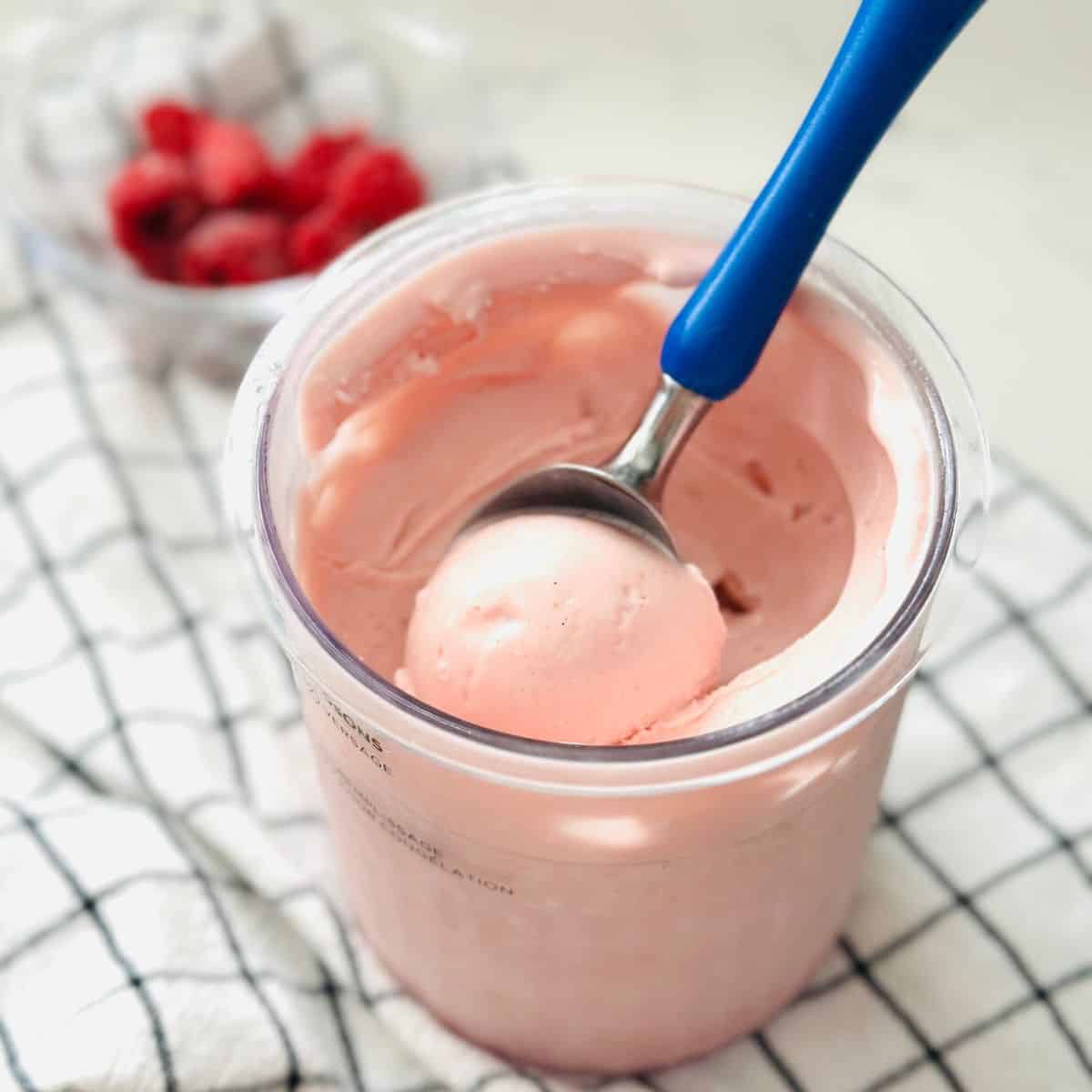 Creamy rose raspberry ice cream made using ninja creami ready to be enjoyed.