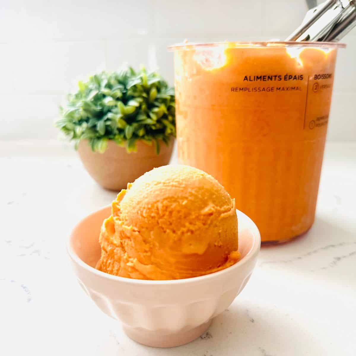 Scoops of thai tea ice cream in a bowl ready to be enjoyed.