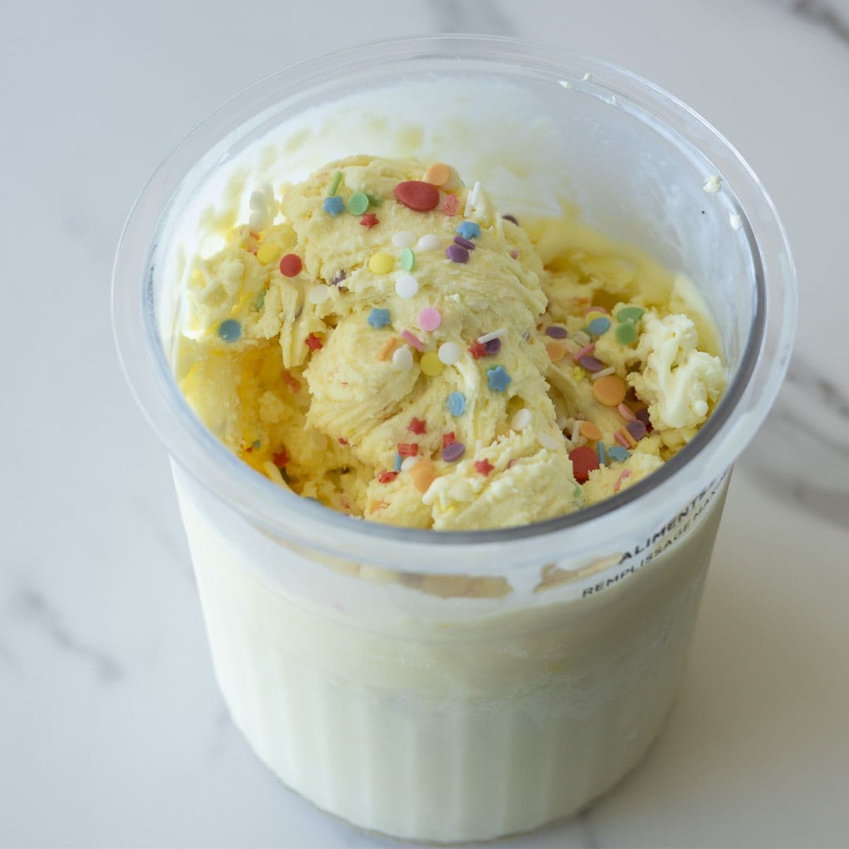 Homemade birthday cake ice cream made with the Ninja Creami, featuring a creamy texture, rich vanilla flavor, and colorful sprinkles for a festive treat.