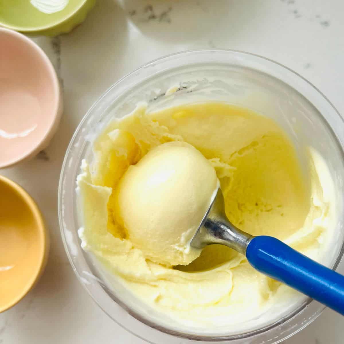 Scoop of homemade birthday cake ice cream made with the Ninja Creami, featuring a creamy texture, rich vanilla flavor.