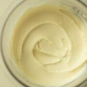 Creamy marshmallow ice cream with a soft, fluffy texture, featuring swirls of marshmallow for a sweet and airy treat.