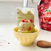 Scoop of matcha strawberry ice cream.