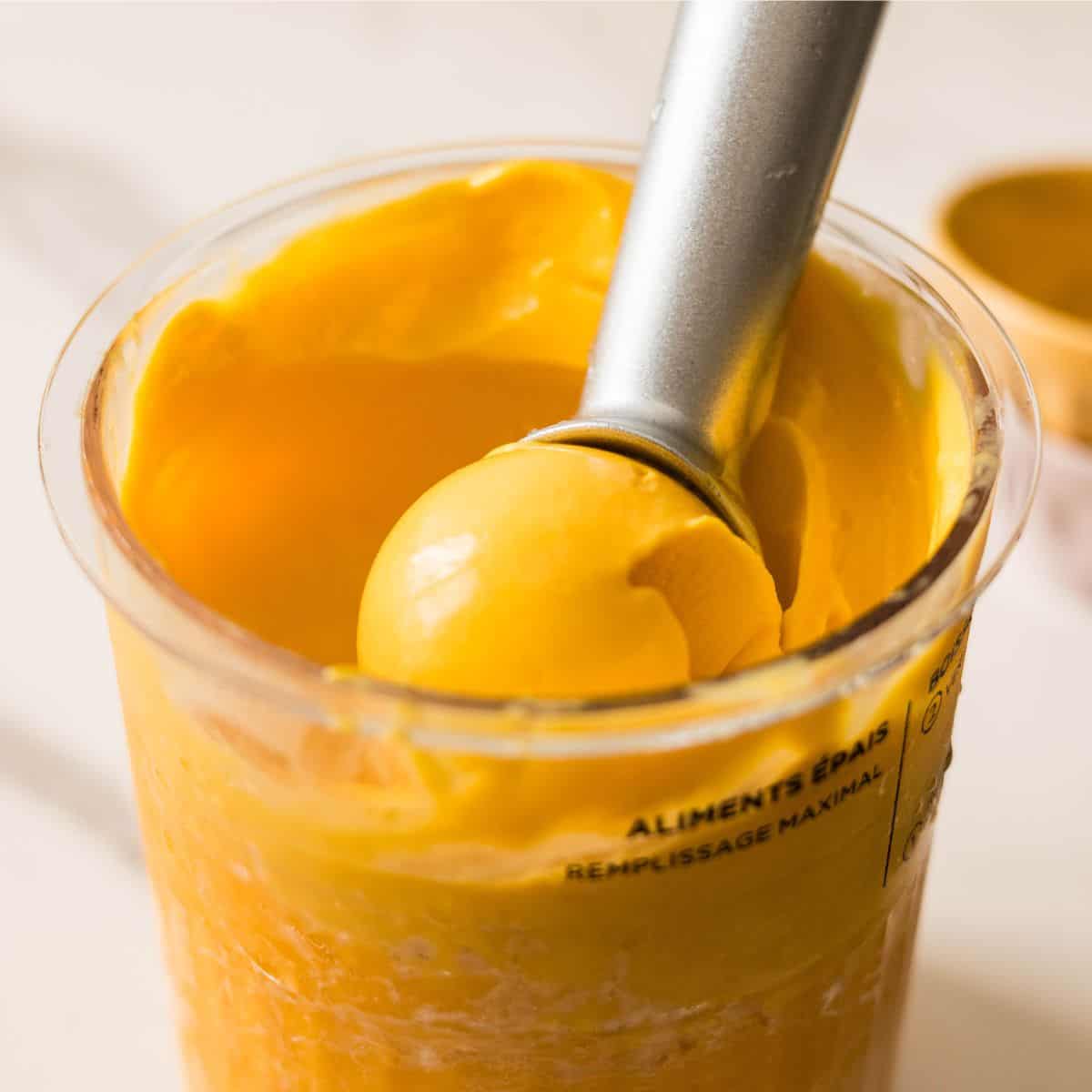Creamy 3-ingredient mango ice cream made with fresh mangoes, sweetened condensed milk, and half and half.