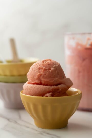 NInja Creami strawberry ice cream on small bowl.