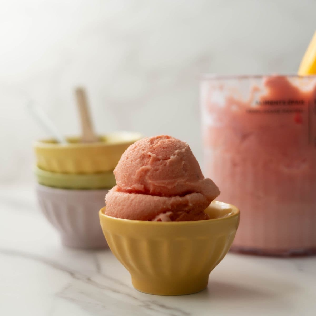 NInja Creami strawberry ice cream on small bowl.