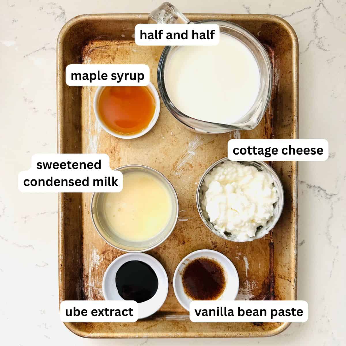 Ingredients for Ninja Creami Maple Ube Latte Ice Cream — half & half, cottage cheese, maple syrup, and ube extract ready to blend.