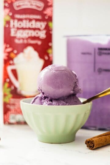 Creamy Ninja Creami ube eggnog ice cream in a bowl ready to eat.