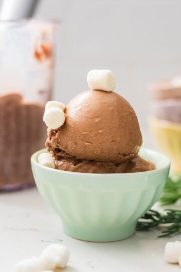 Finished Ninja Creami Spiced Hot Chocolate Ice Cream topped with marshmallows in a bowl.