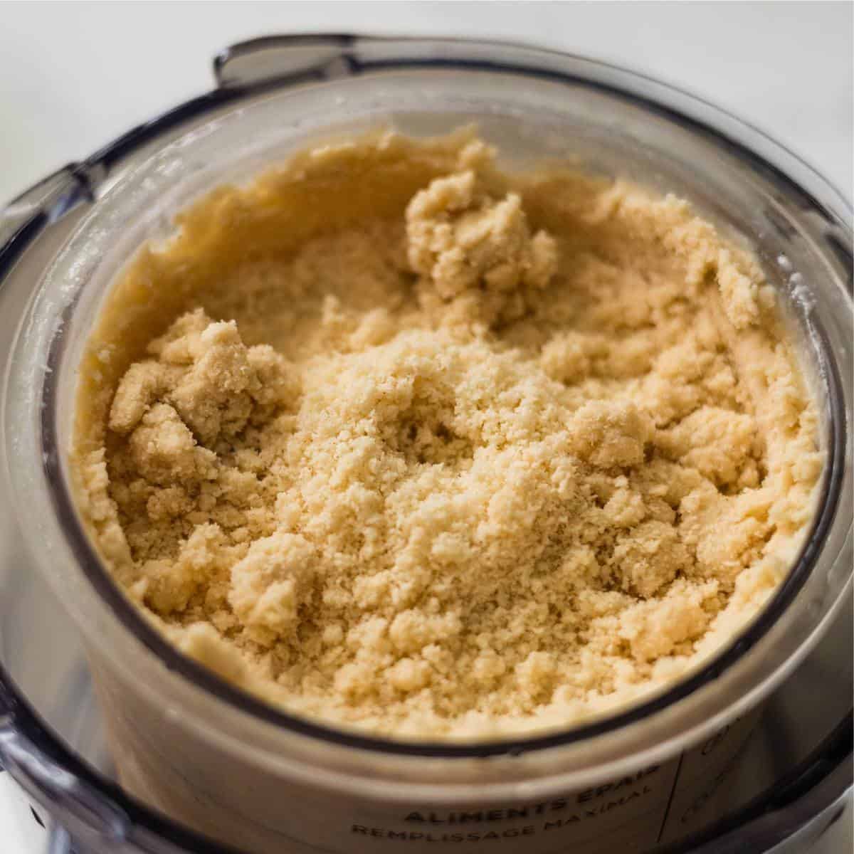 Frozen Chai Tea Latte ice cream mixture on a Ninja Creami pint showing crumbly texture.