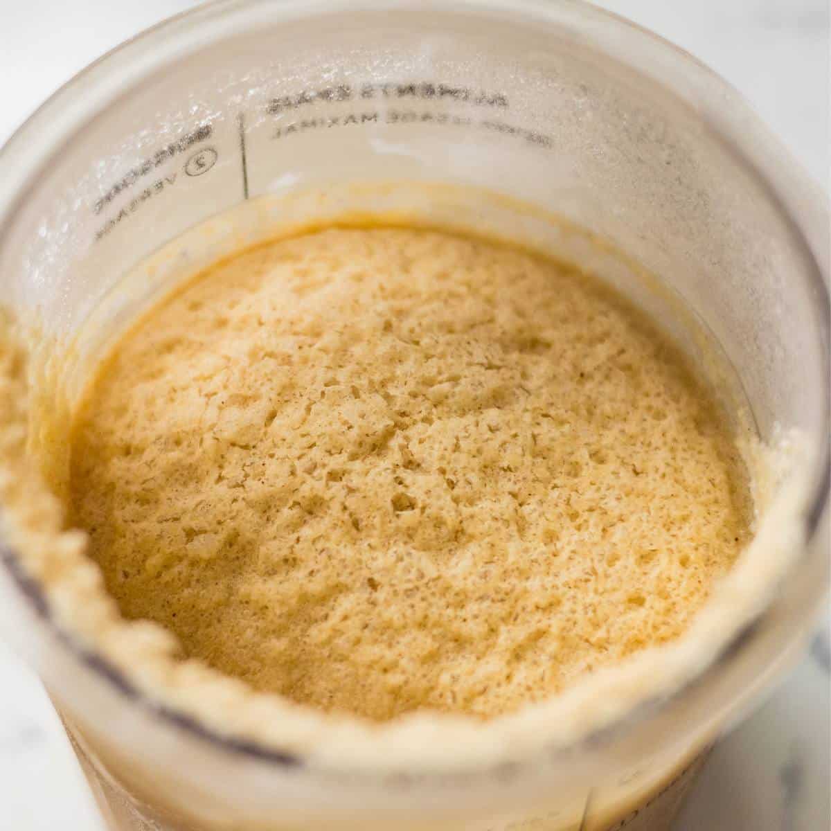 Frozen Chai Tea Latte ice cream mixture on a Ninja Creami pint.