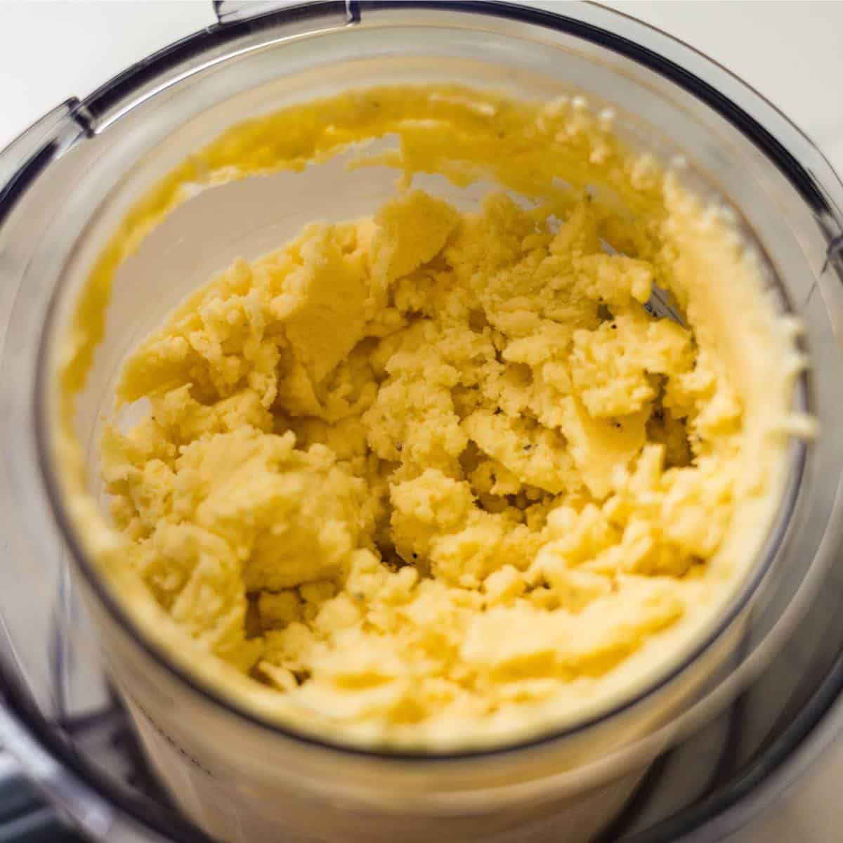 Ninja Creami mango cardamom ice cream after spinning, thick and creamy in the pint.