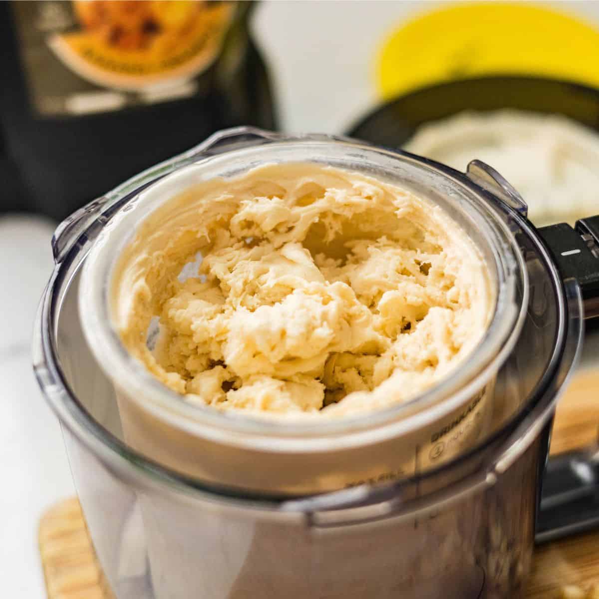 Ninja Creami Banana Ice Cream after the first spin with a crumbly texture before respinning.