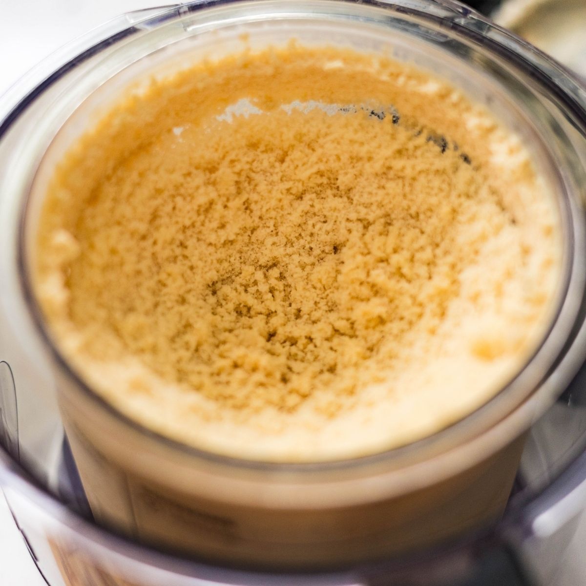 Top view of frozen Ninja Creami high protein peanut butter cup ice cream base after 24 hours in the pint container