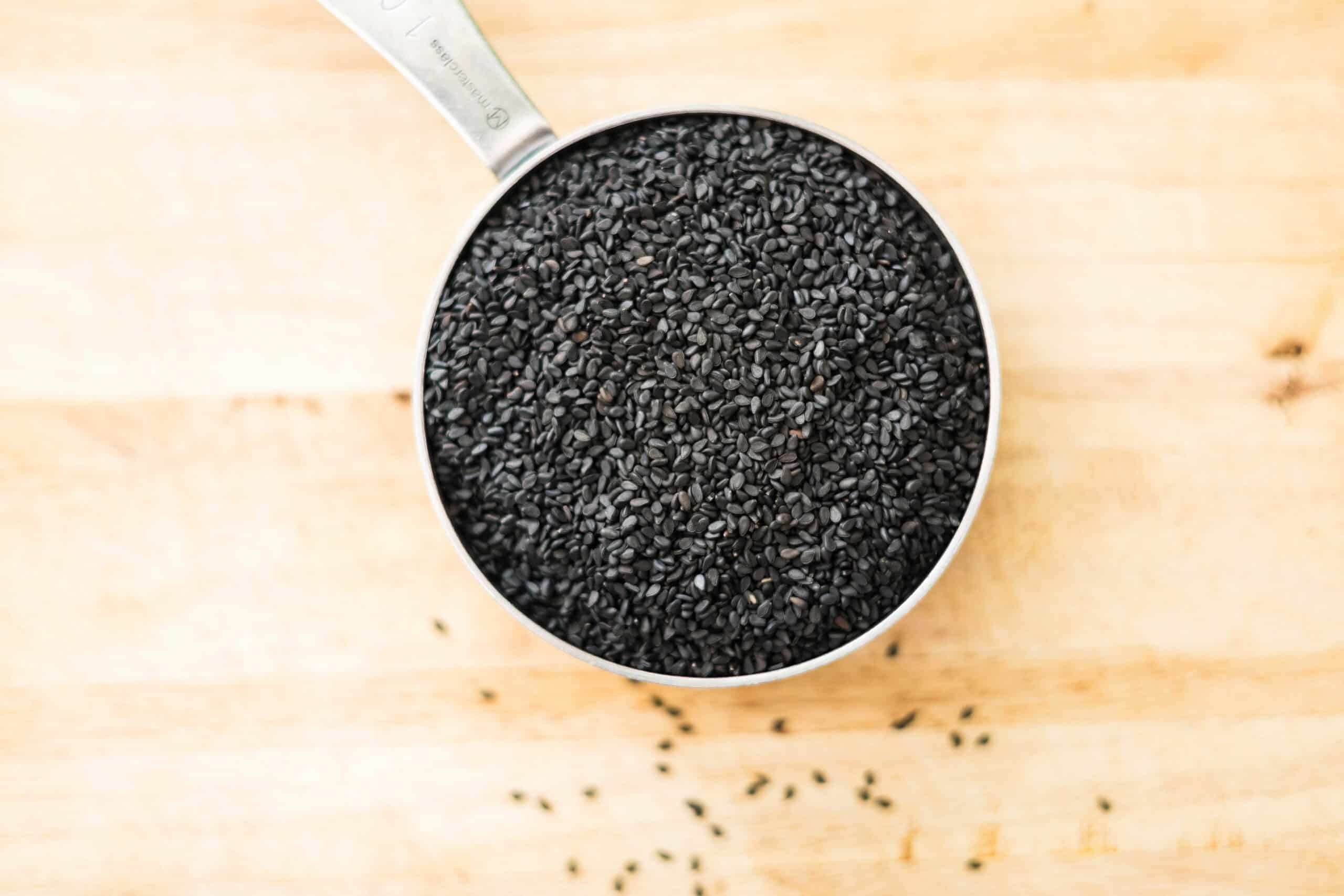 Black sesame seeds in a small cup for making black sesame paste