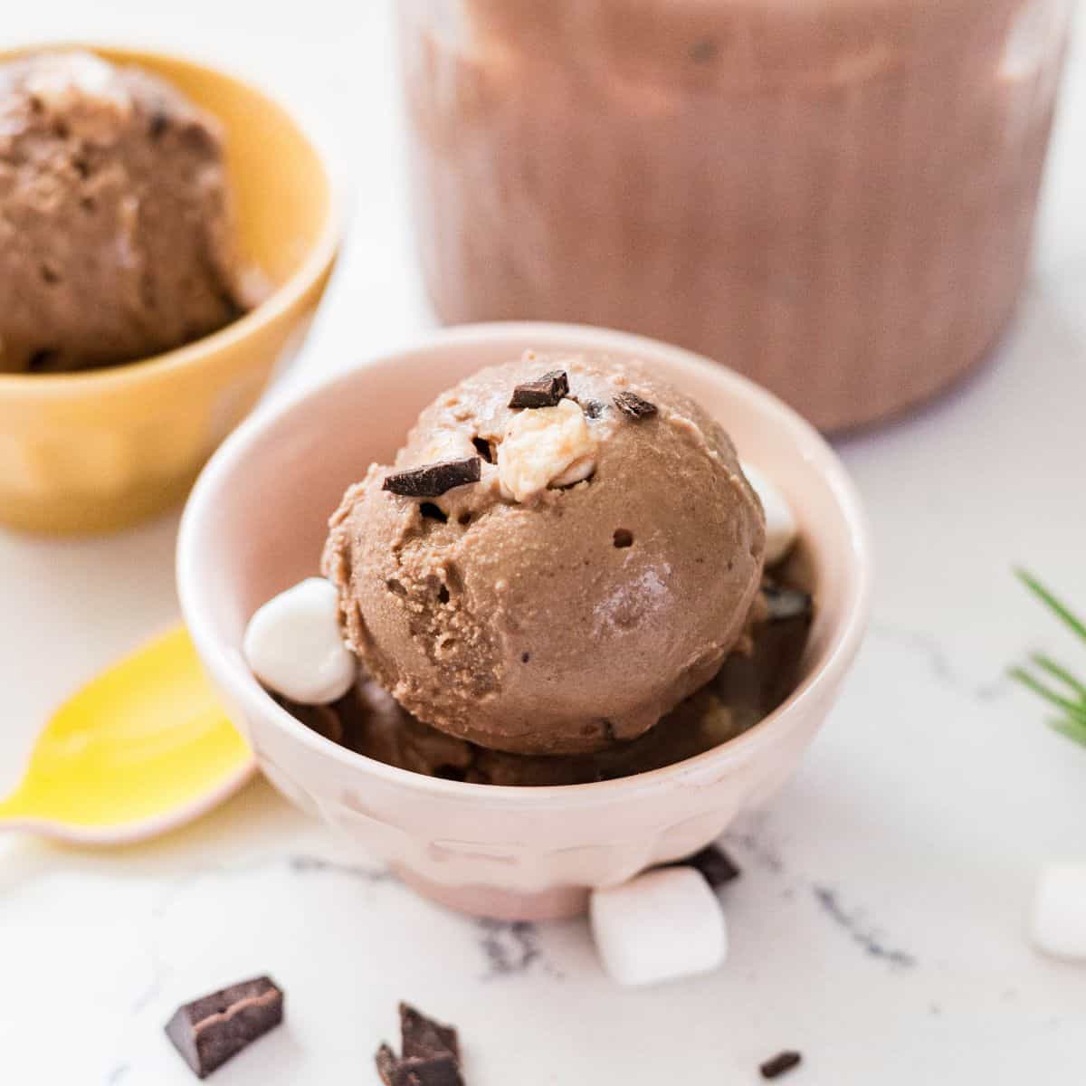 Ninja Creami rocky road ice cream topped with chocolate chunks, marshmallows, and almonds