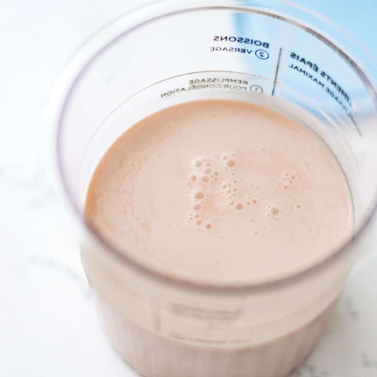 Root beer ice cream base mixed in a Ninja Creami pint before freezing