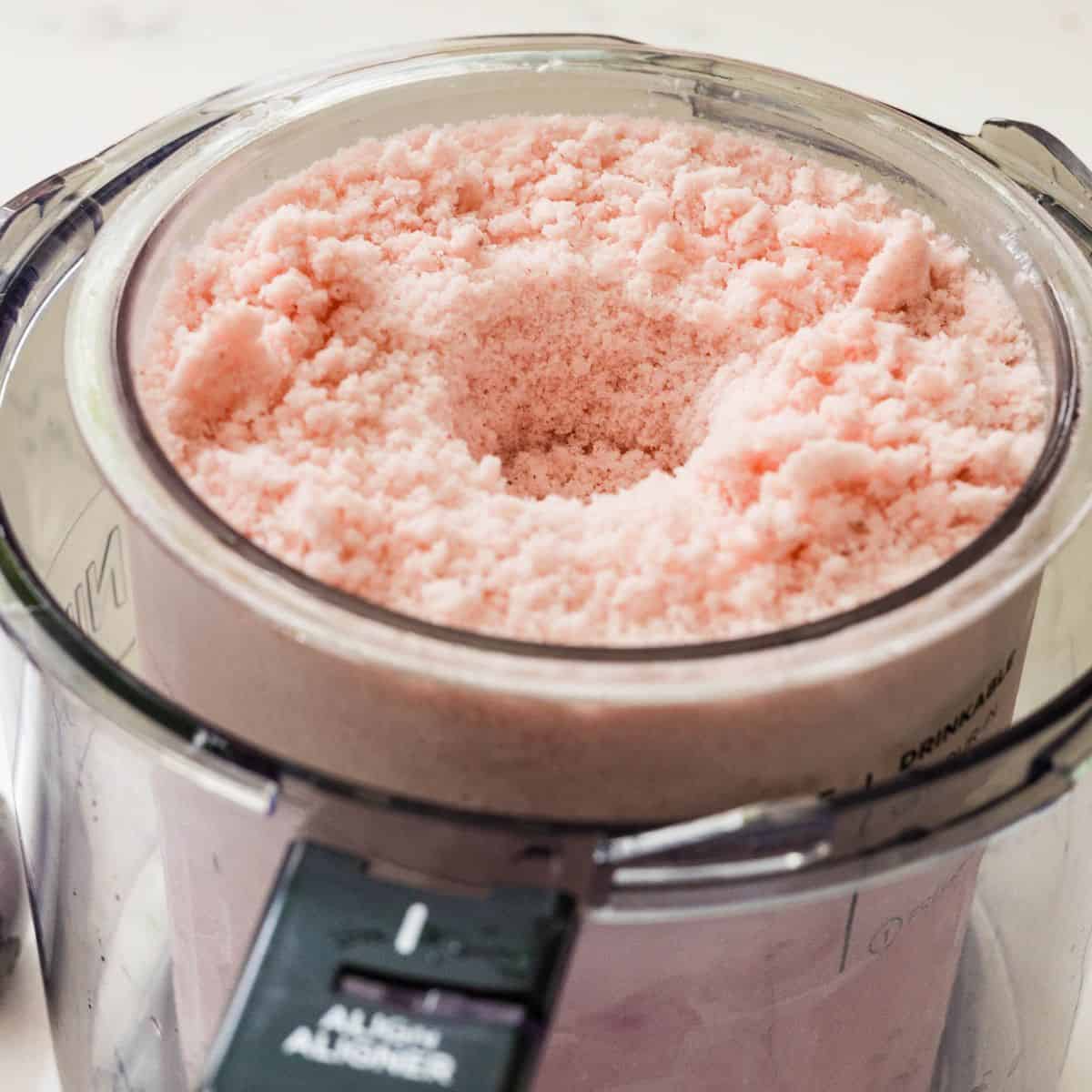 Creamy Ninja Creami strawberry protein frozen yogurt after re-spinning in the pint container