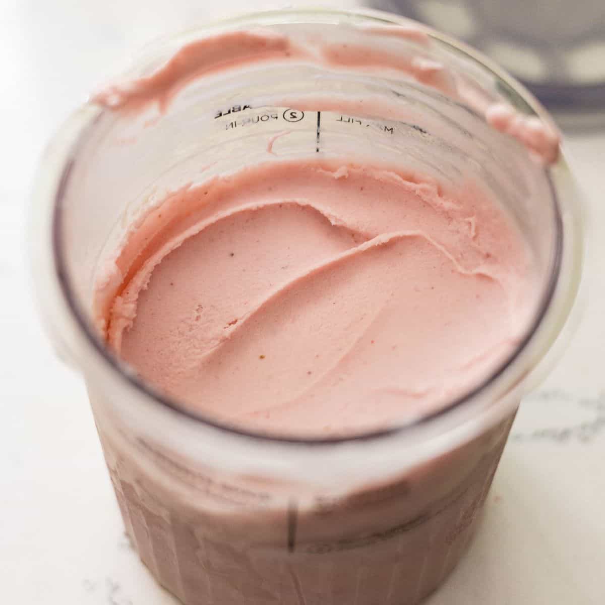 Smooth Ninja Creami strawberry protein frozen yogurt in the pint container ready for scooping