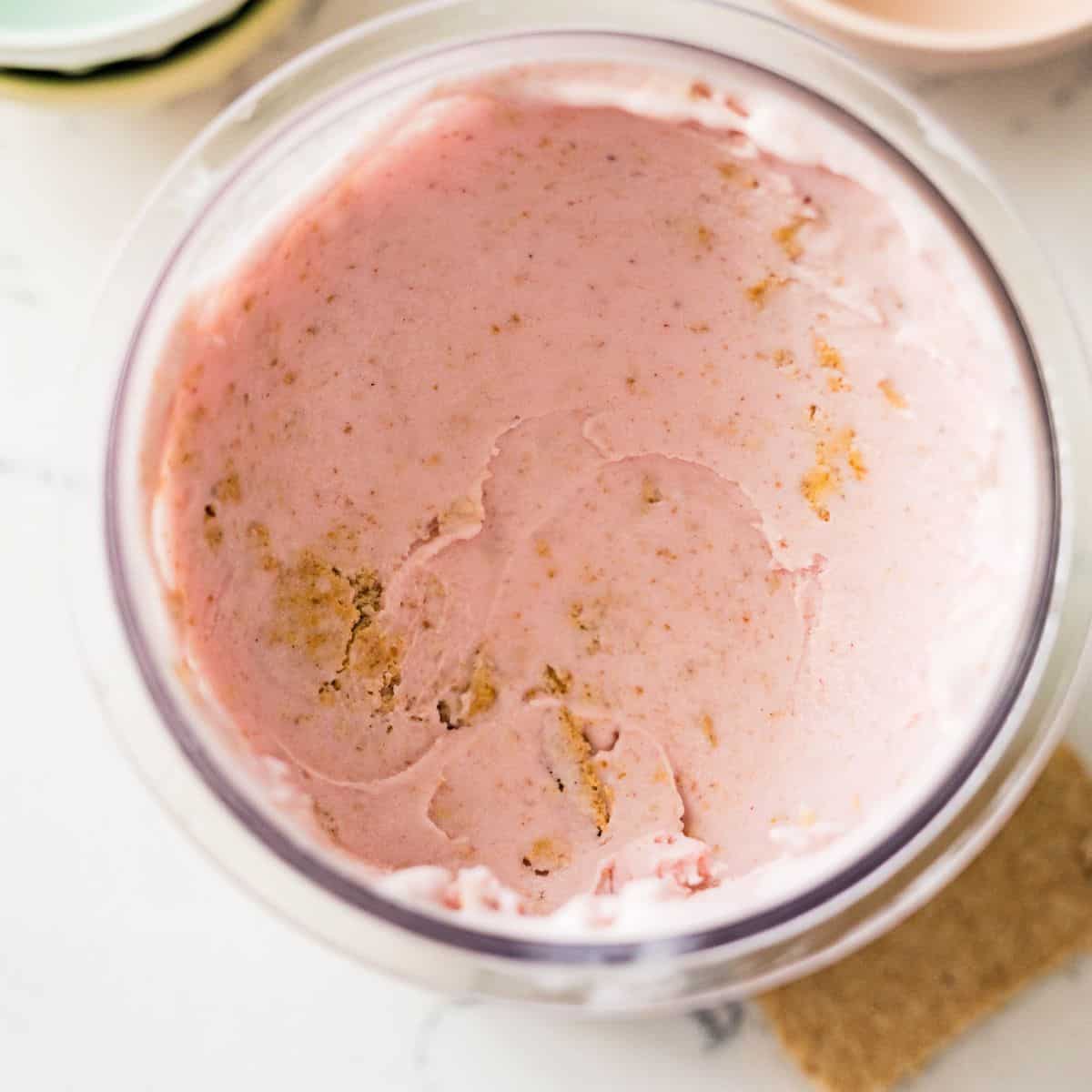 Ninja Creami high protein strawberry cheesecake ice cream with graham cracker pieces mixed in