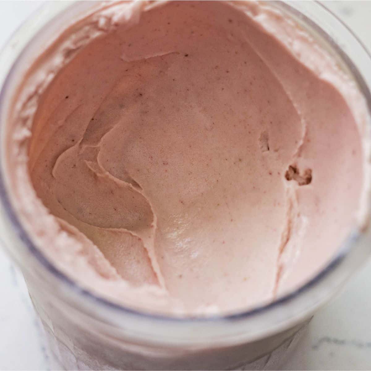 Creamy Ninja Creami strawberry banana ice cream after re-spinning in the pint container