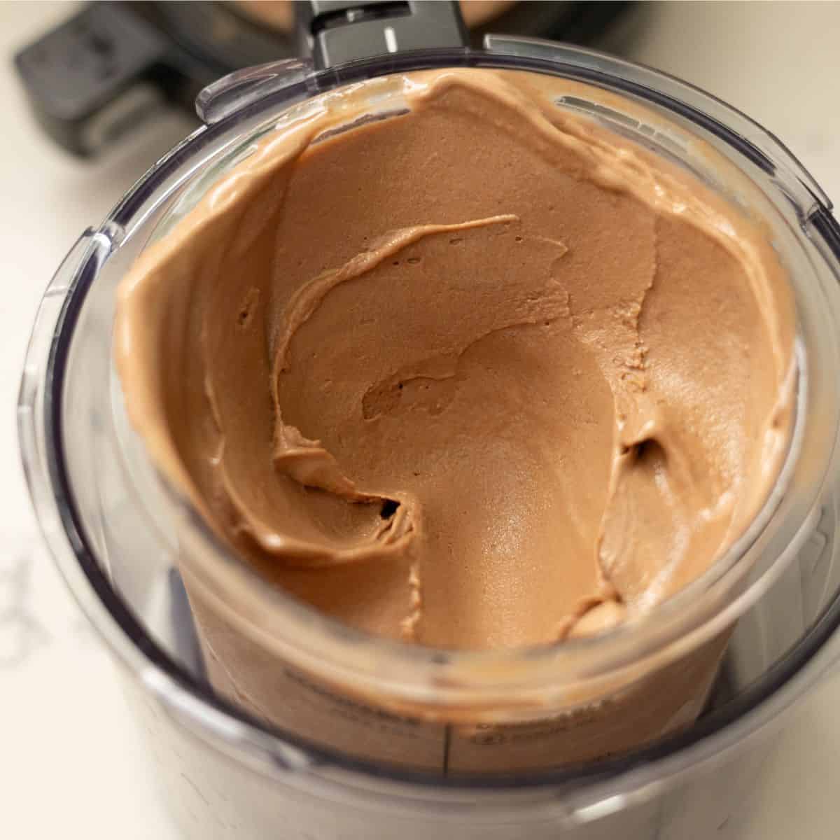 Smooth, creamy chocolate peanut butter ice cream in a Ninja Creami pint after a respin