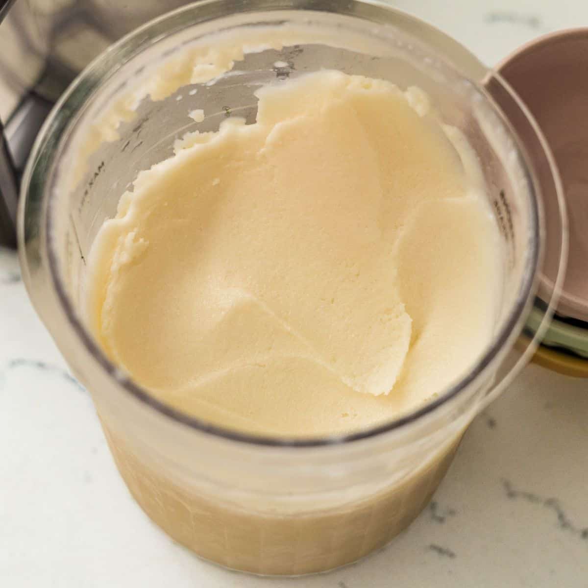 Creamy high-protein vanilla ice cream in a Ninja Creami pint