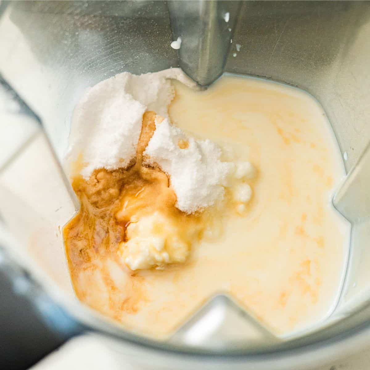 Mixing cottage cheese, vanilla, and protein shake for protein ice cream