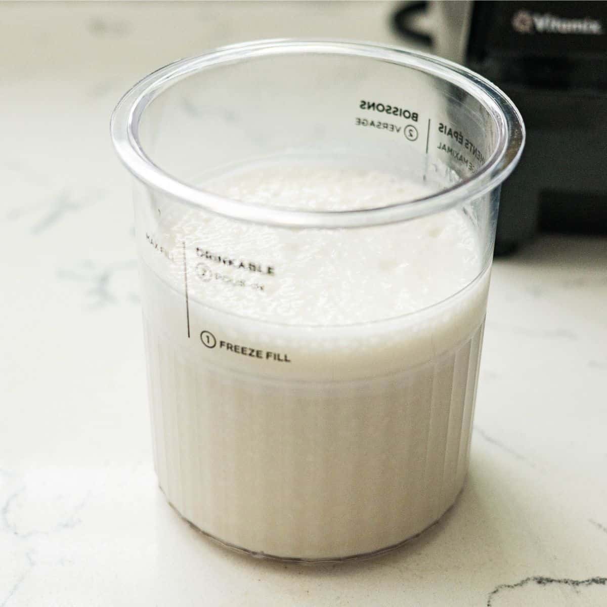 Protein ice cream base poured into a Ninja Creami pint